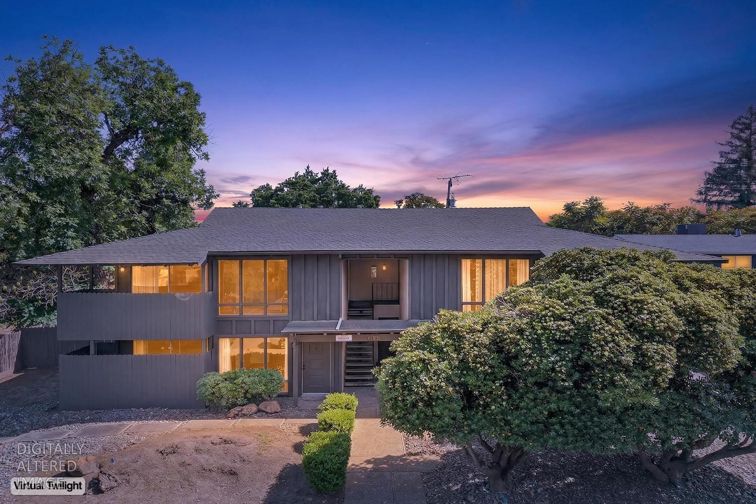 a front view of a house with a yard