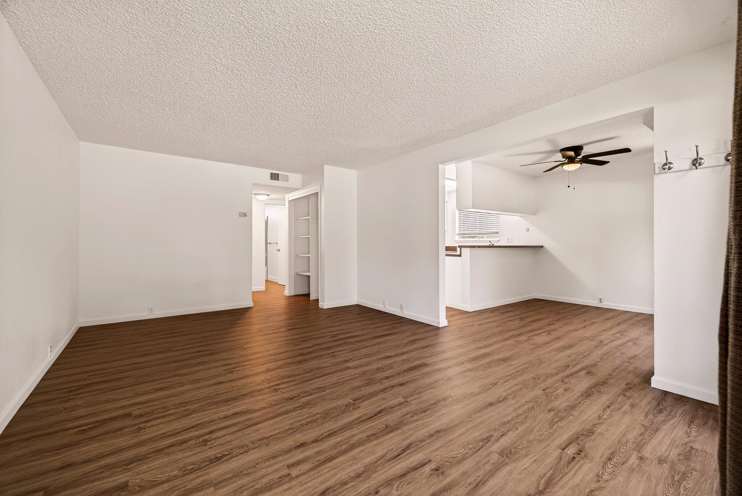 615 Rancheria Drive Chico, CA 95926 - Photo 11 of 80 an empty room with wooden floor and windows