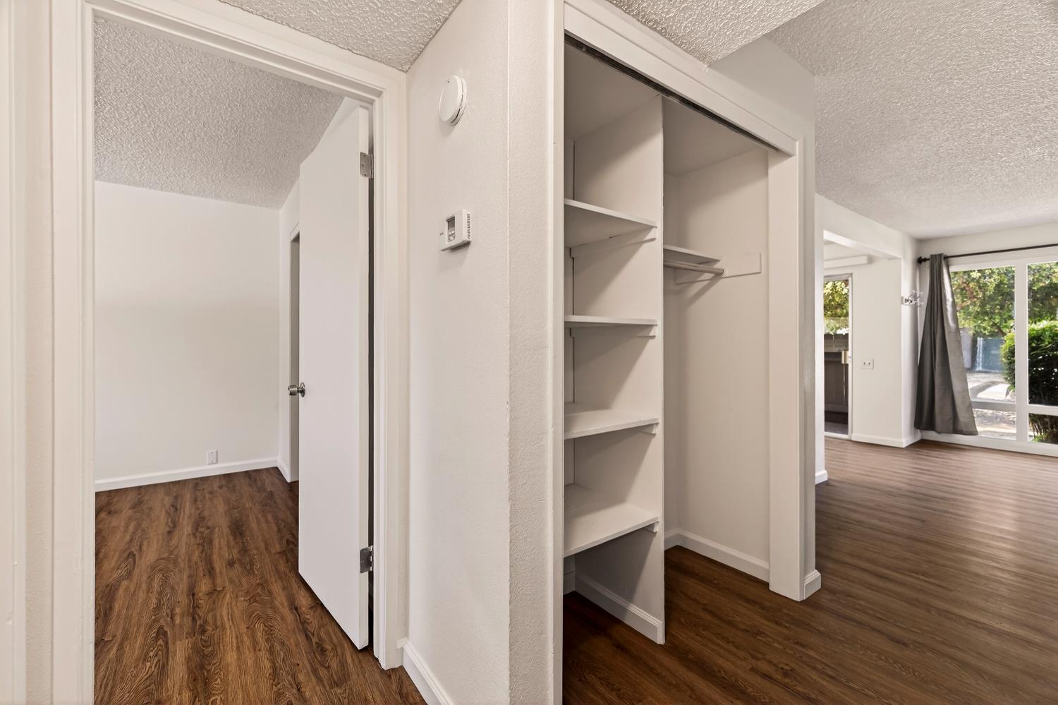 615 Rancheria Drive Chico, CA 95926 - Photo 20 of 80 a view of a hallway with wooden floor and closet