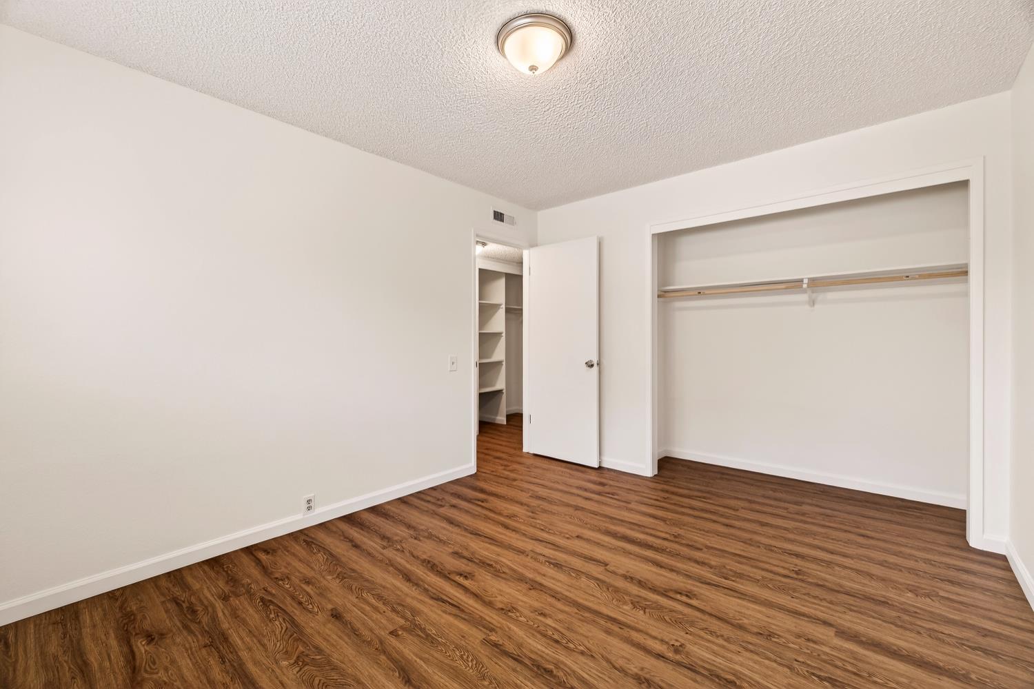 615 Rancheria Drive Chico, CA 95926 - Photo 22 of 80 an empty room with wooden floor and closet