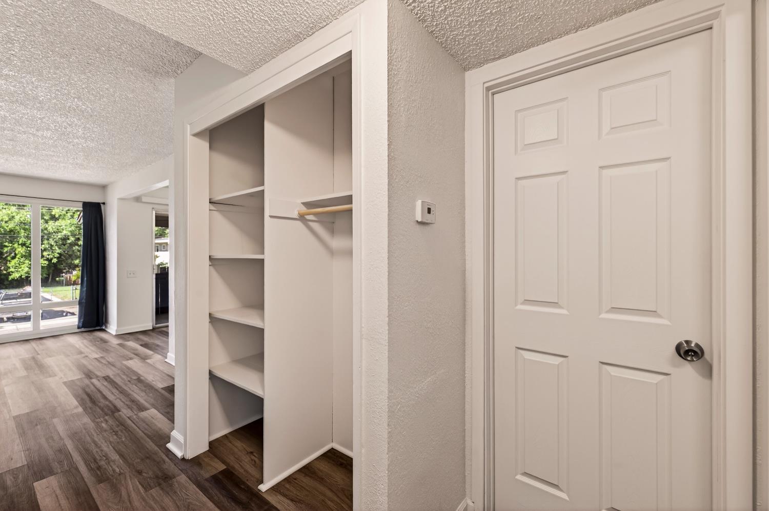 615 Rancheria Drive Chico, CA 95926 - Photo 28 of 80 an empty room with wooden floor closet and windows