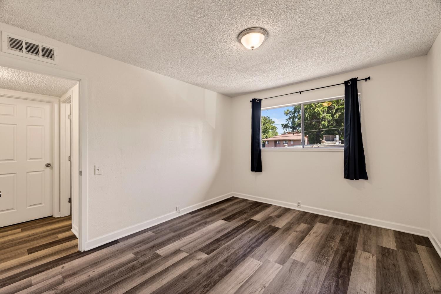 615 Rancheria Drive Chico, CA 95926 - Photo 43 of 80 a view of small space with wooden floor and a window