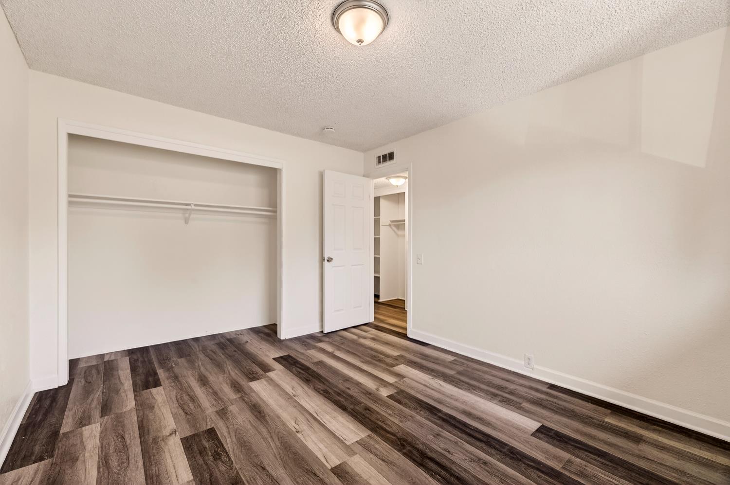 615 Rancheria Drive Chico, CA 95926 - Photo 44 of 80 a view of a room with wooden floor and closet