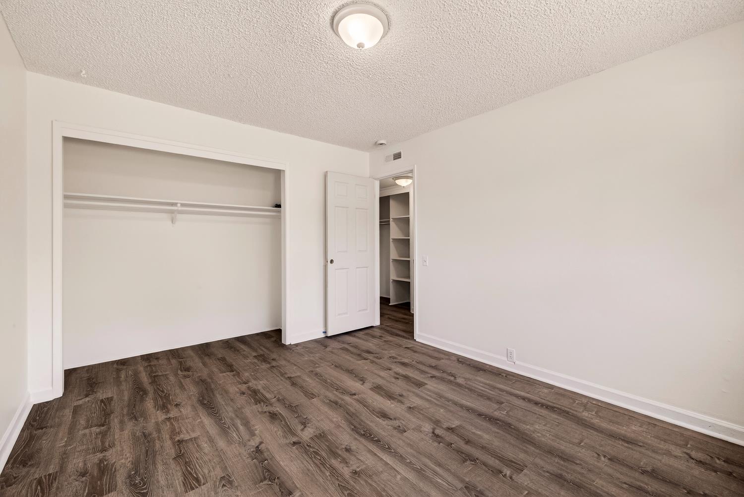 615 Rancheria Drive Chico, CA 95926 - Photo 63 of 80 an empty room with wooden floor and closet