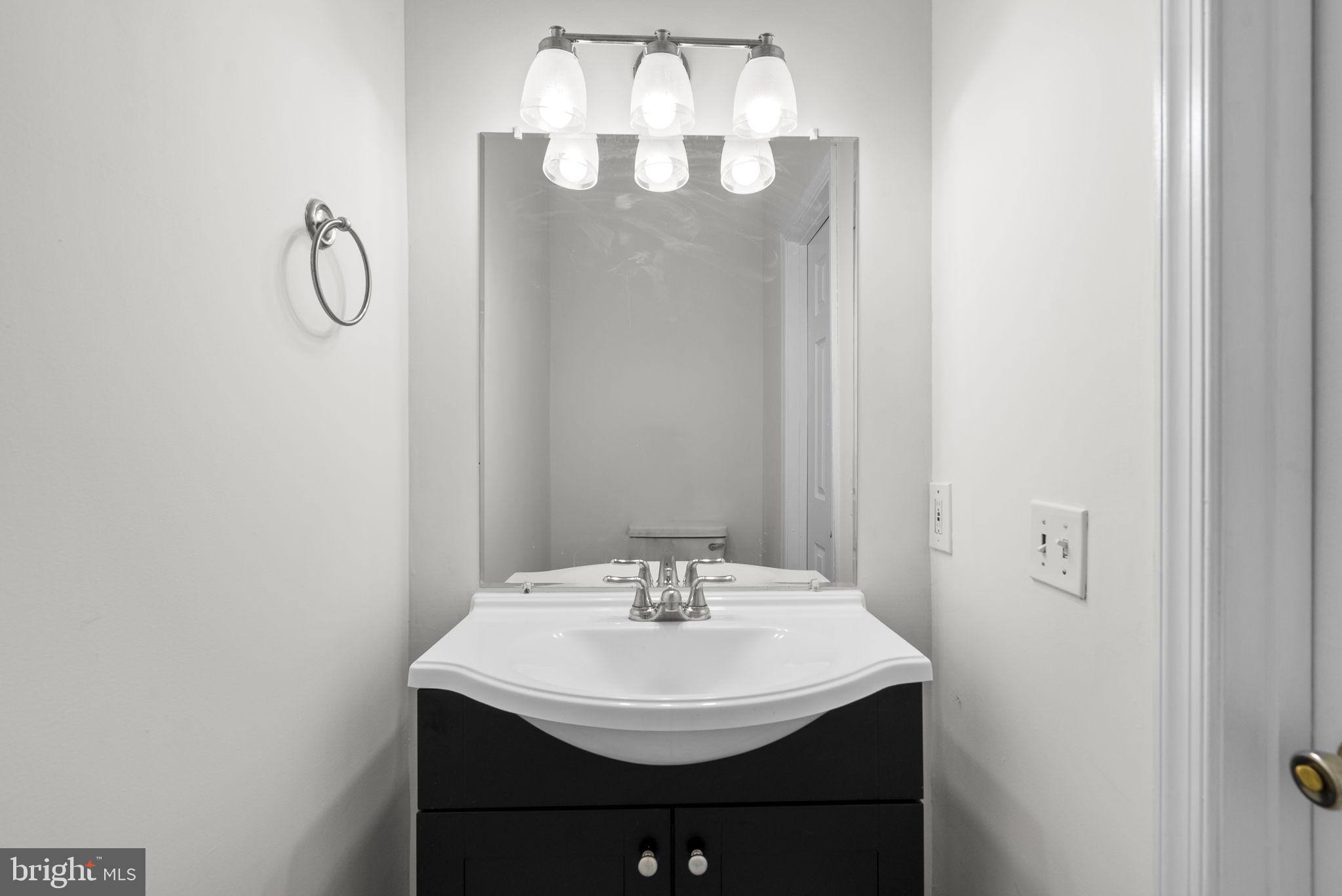 24000 Clarksburg Road Clarksburg, MD 20871 - Photo 20 of 60 a bathroom with a sink and a mirror