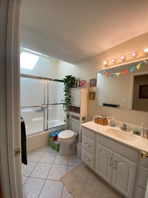 14 Park Place, Unit 14 Arlington, MA 02474 - Photo 11 of 20 a bathroom with a toilet sink double vanity and mirror