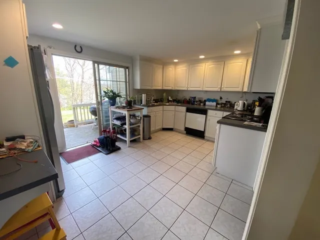 a kitchen with sink cabinets and appliances