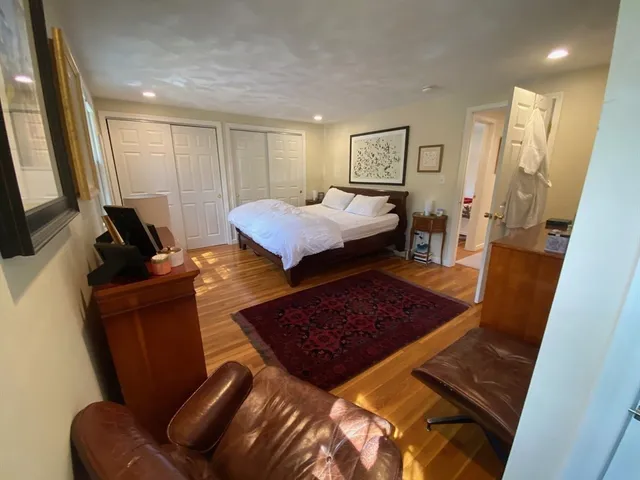 a bed room with a bed window and a couch