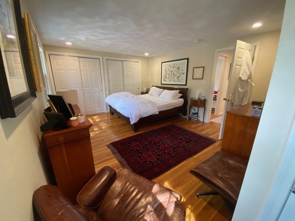 14 Park Place, Unit 14 Arlington, MA 02474 - Photo 10 of 20 a bed room with a bed window and a couch