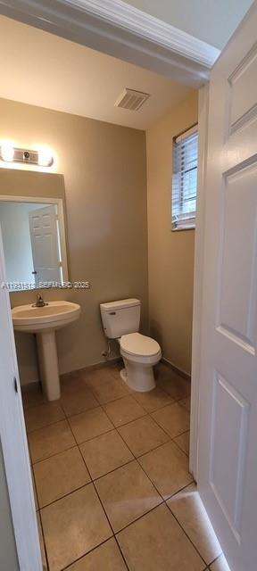 1400 Lucaya Drive Riviera Beach, FL 33404 - Photo 12 of 14 a bathroom with a toilet and a shower
