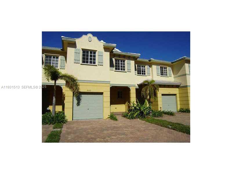 1400 Lucaya Drive Riviera Beach, FL 33404 - Photo 14 of 14 a front view of a house with a yard