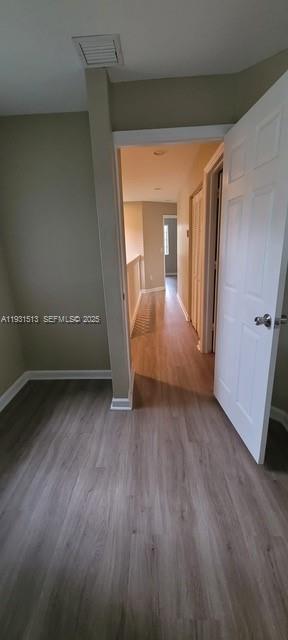 1400 Lucaya Drive Riviera Beach, FL 33404 - Photo 10 of 14 an empty room with wooden floor and windows