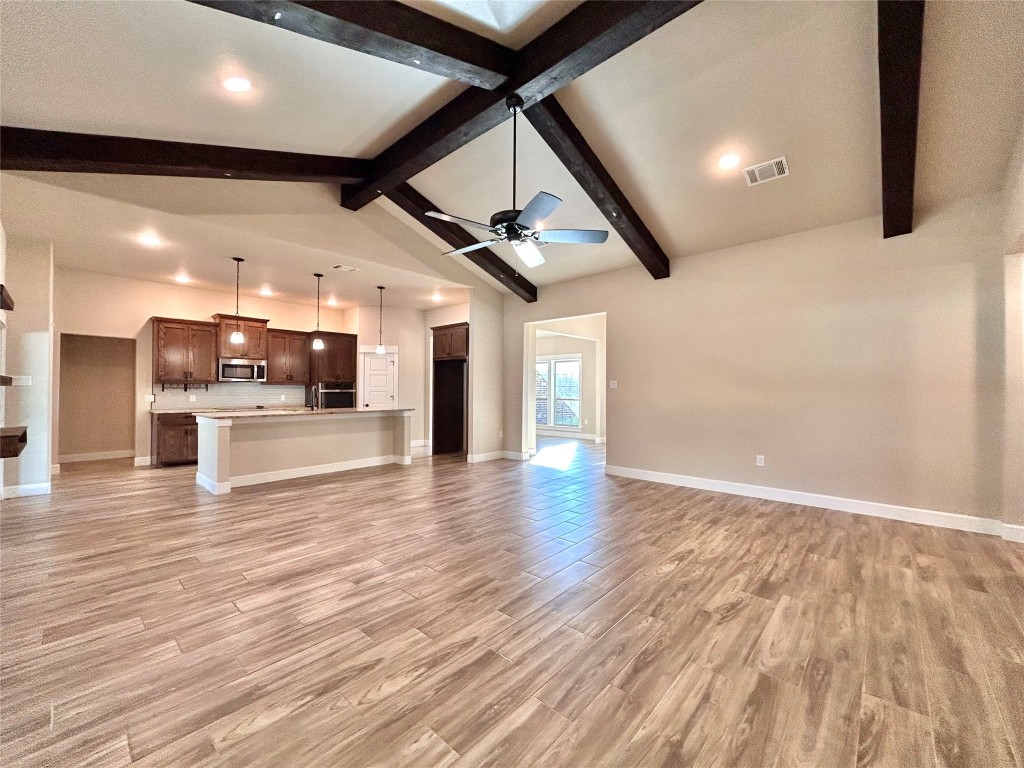 Unfurnished living room with recessed lighting, light wood-style floors, and a ceiling fan