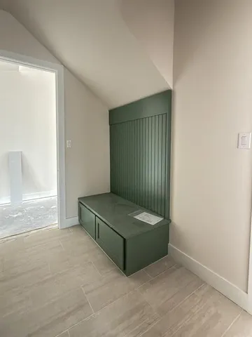 a spacious bathroom with a tub sink and mirror