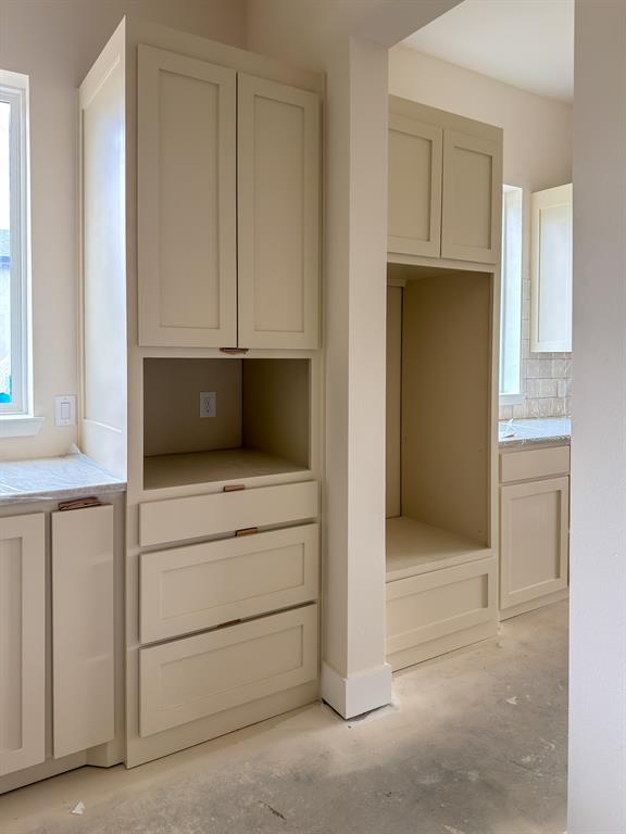 208 Pecan Street Roanoke, TX 76262 - Photo 14 of 38 a kitchen with a cabinets and a stove