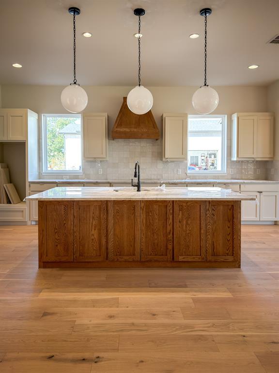 208 Pecan Street Roanoke, TX 76262 - Photo 15 of 38 a kitchen with a cabinets and a large window
