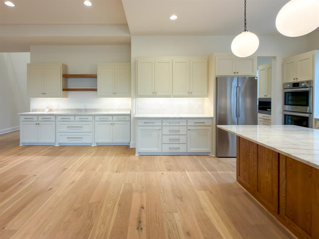 208 Pecan Street Roanoke, TX 76262 - Photo 18 of 38 a view of kitchen with wooden floor