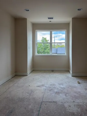 a spacious bathroom with a double vanity sink and a mirror
