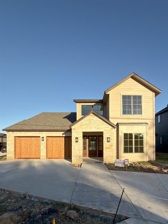 208 Pecan Street Roanoke, TX 76262 - Photo 2 of 38 a front view of a house with a yard