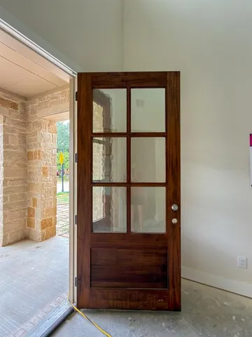 a view of front door and bedroom