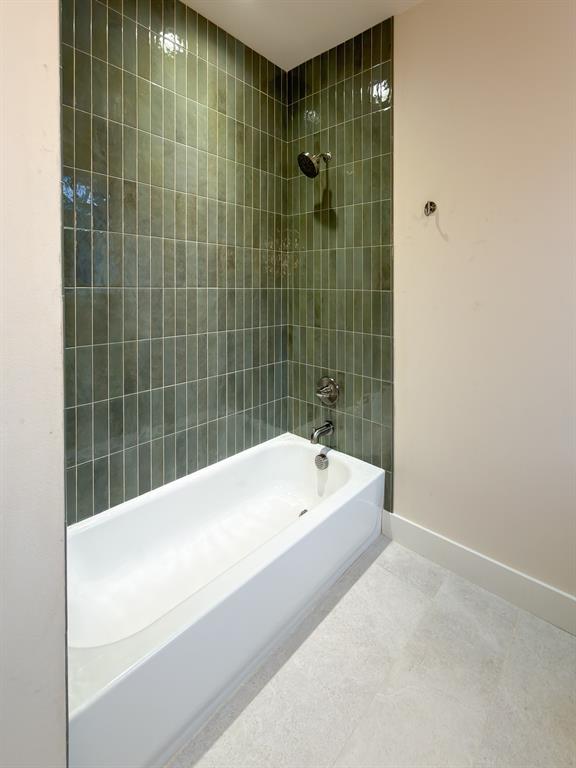 208 Pecan Street Roanoke, TX 76262 - Photo 32 of 38 a bathroom with a bathtub and shower