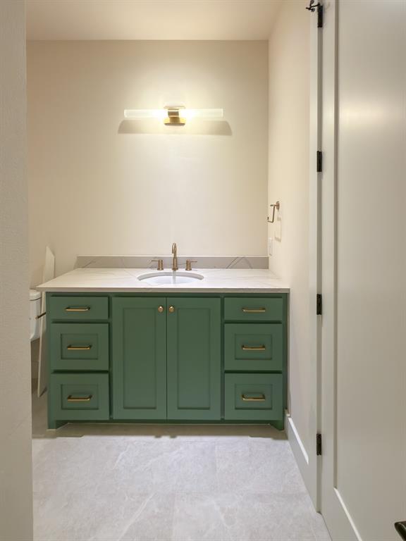 208 Pecan Street Roanoke, TX 76262 - Photo 35 of 38 a bathroom with a sink and a mirror