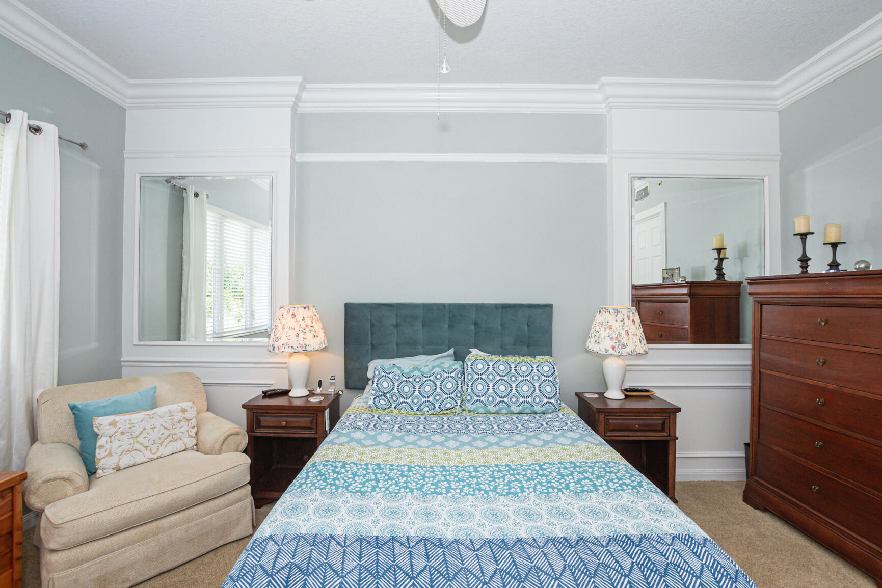 35 Harbour Isle Drive West, Unit 302 Fort Pierce, FL 34949 - Photo 11 of 30 a bedroom with a bed and wooden floor