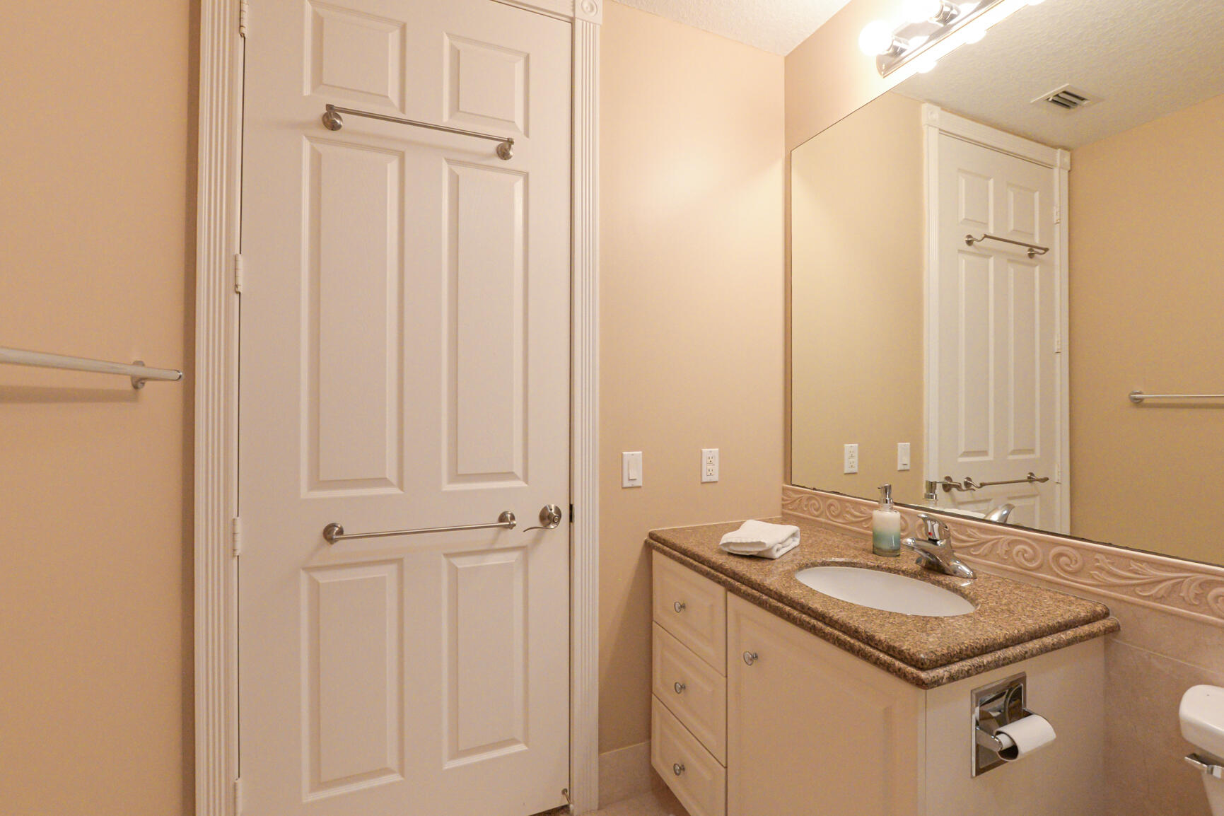 35 Harbour Isle Drive West, Unit 302 Fort Pierce, FL 34949 - Photo 19 of 30 a bathroom with a sink and a mirror