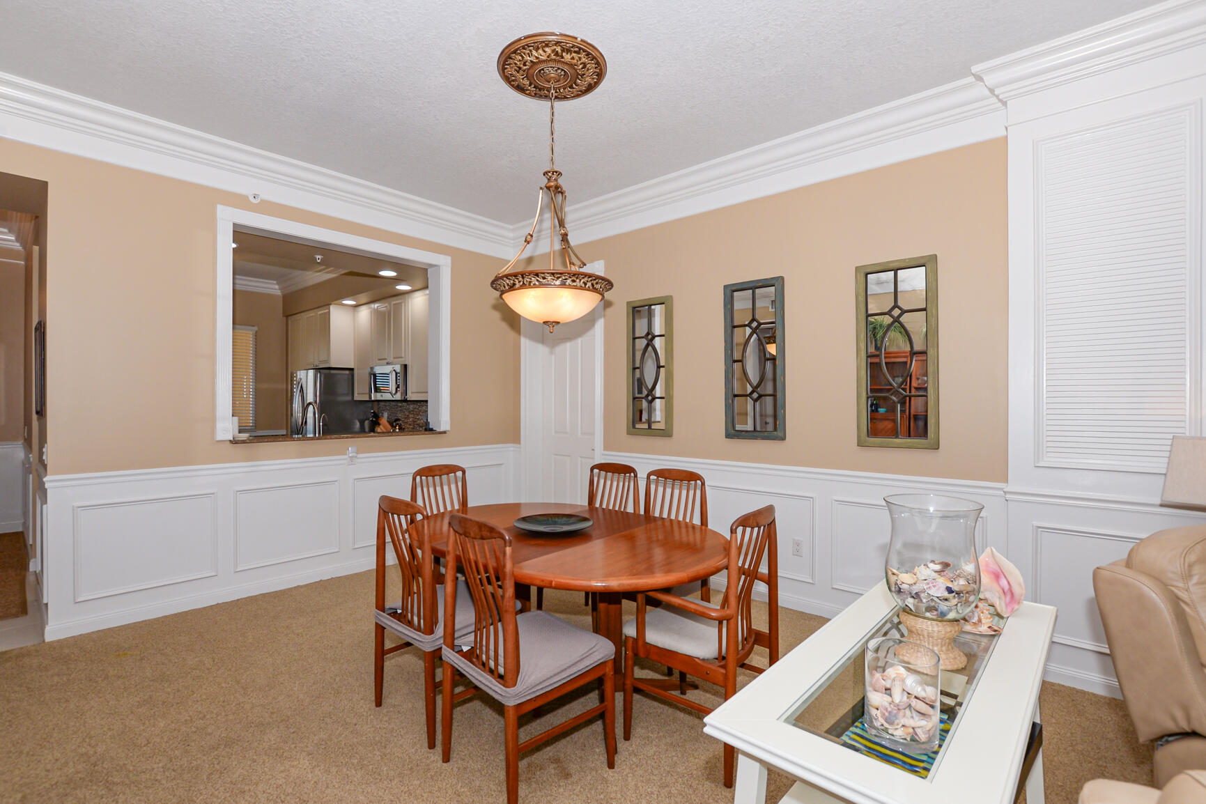 35 Harbour Isle Drive West, Unit 302 Fort Pierce, FL 34949 - Photo 9 of 30 a view of a dining room with furniture and a chandelier