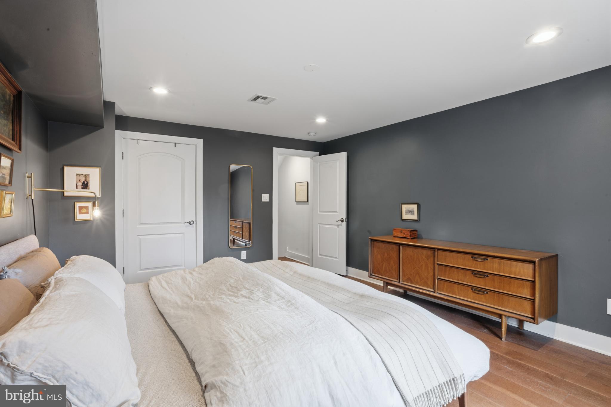 173 West Price Street Philadelphia, PA 19144 - Photo 17 of 40 a spacious bedroom with a bed and a dresser