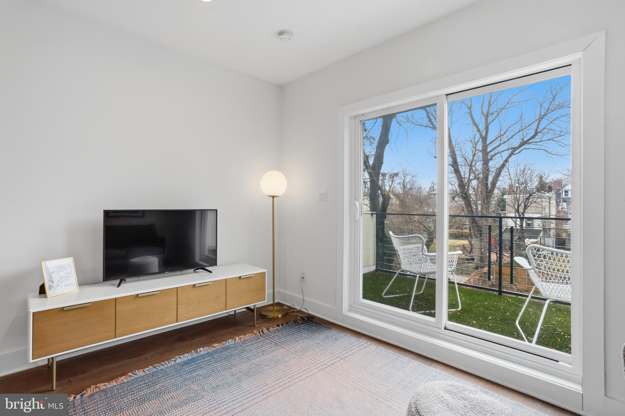 173 West Price Street Philadelphia, PA 19144 - Photo 25 of 40 a view of room with window and flat screen tv