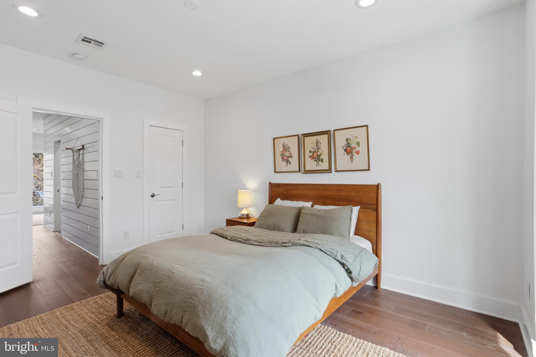 173 West Price Street Philadelphia, PA 19144 - Photo 32 of 40 a bedroom with a bed and wooden floor