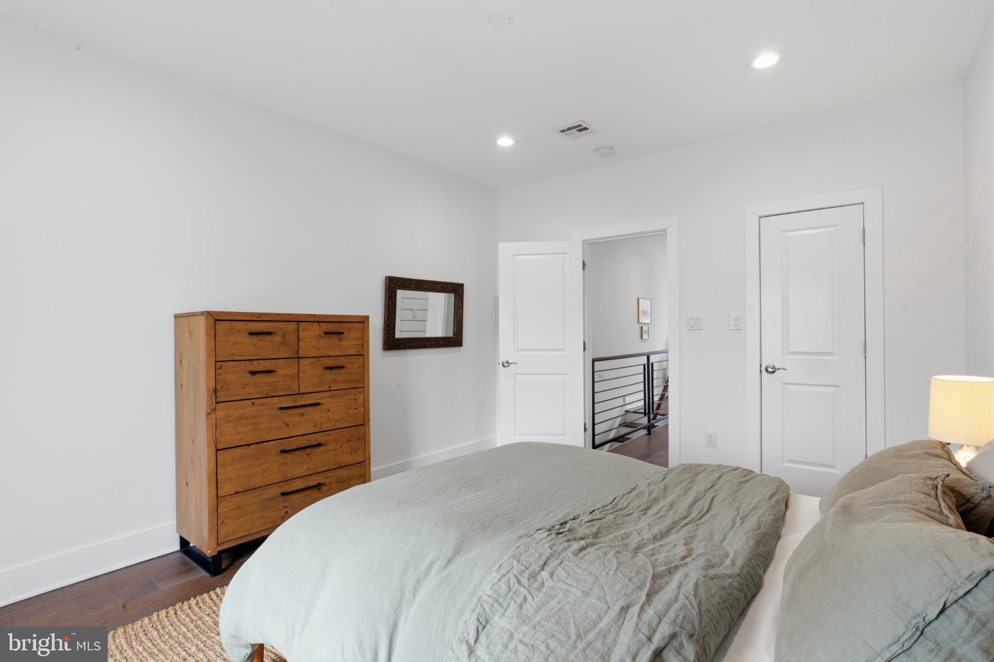 173 West Price Street Philadelphia, PA 19144 - Photo 33 of 40 a bedroom with a bed and a dresser