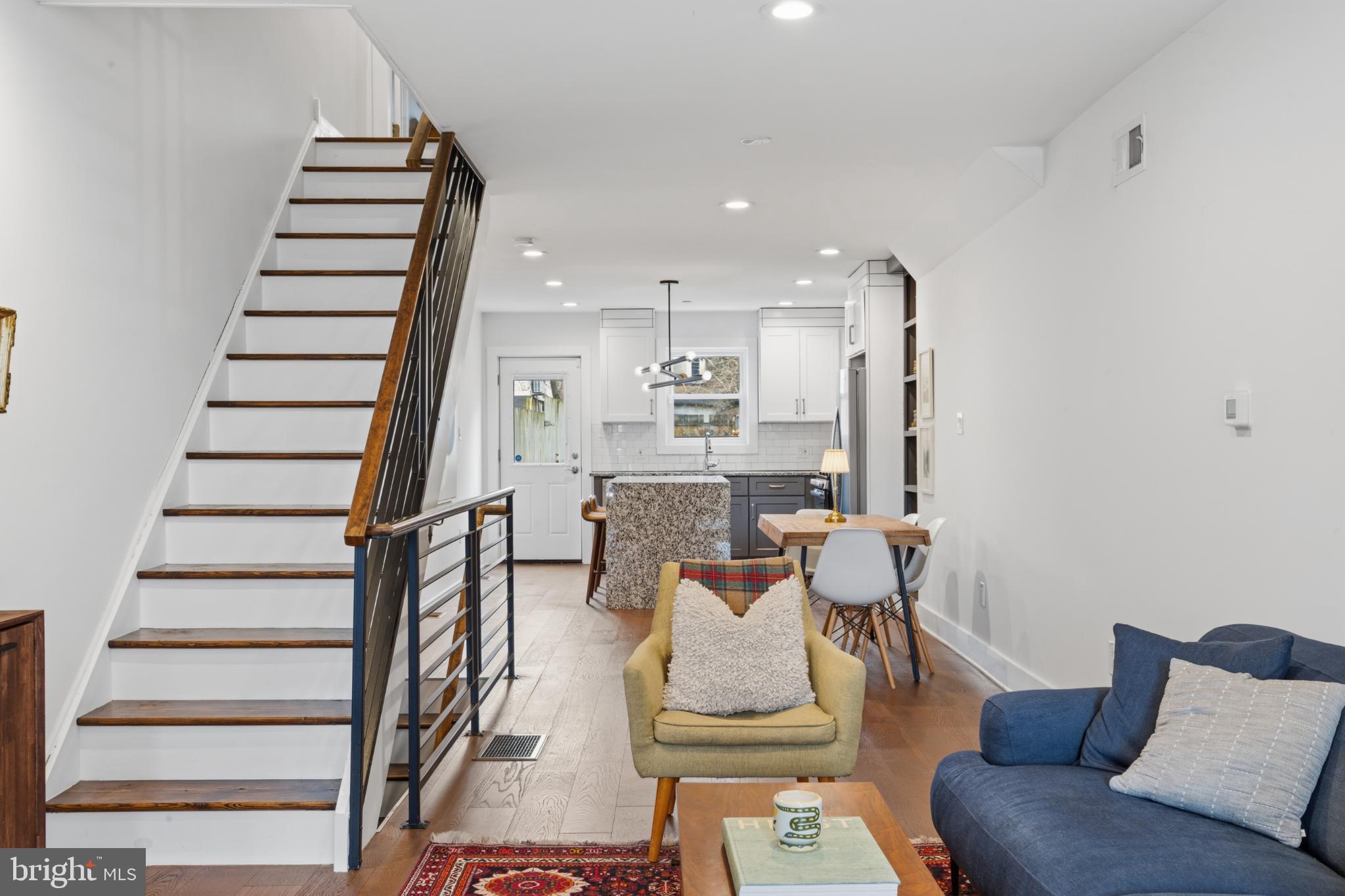 173 West Price Street Philadelphia, PA 19144 - Photo 6 of 40 a living room with furniture and a stairs