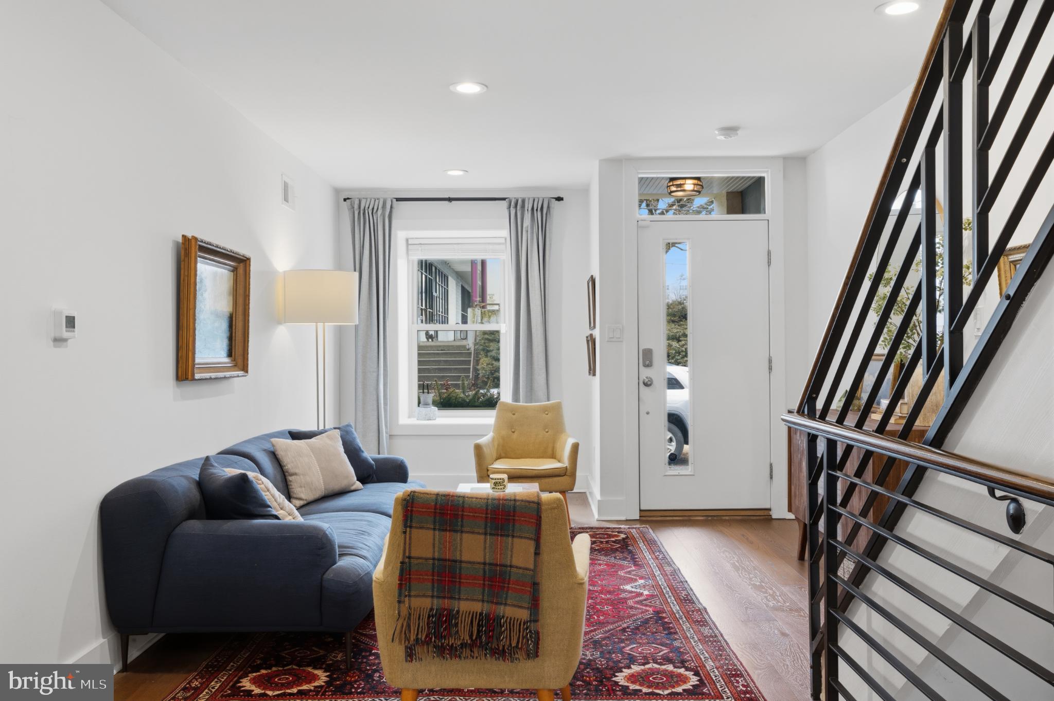 173 West Price Street Philadelphia, PA 19144 - Photo 10 of 40 a living room with furniture and a rug