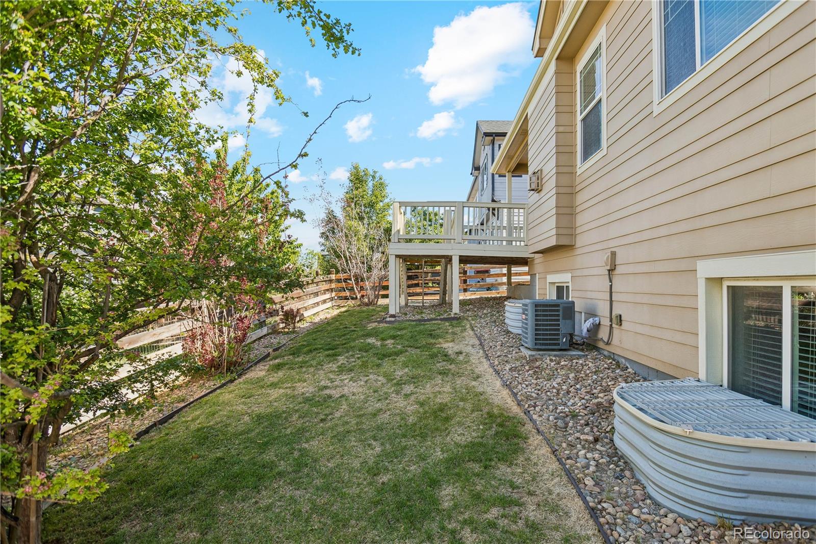 5031 South Rome Street Aurora, CO 80015 - Photo 38 of 39 a backyard of a house with fountain table and chairs