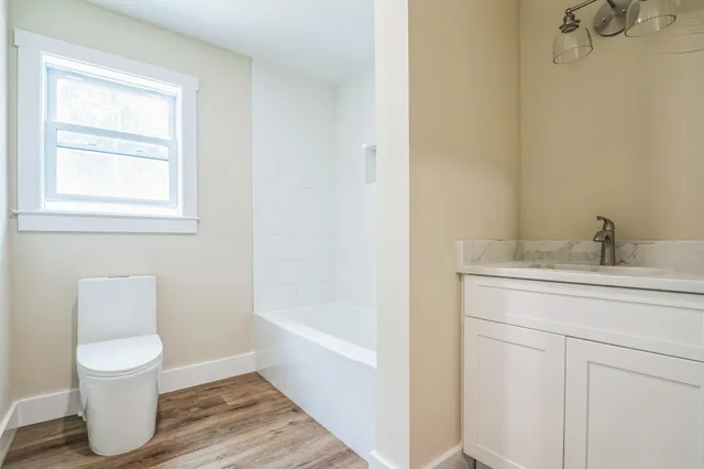 a bathroom with a toilet sink and a bathtub