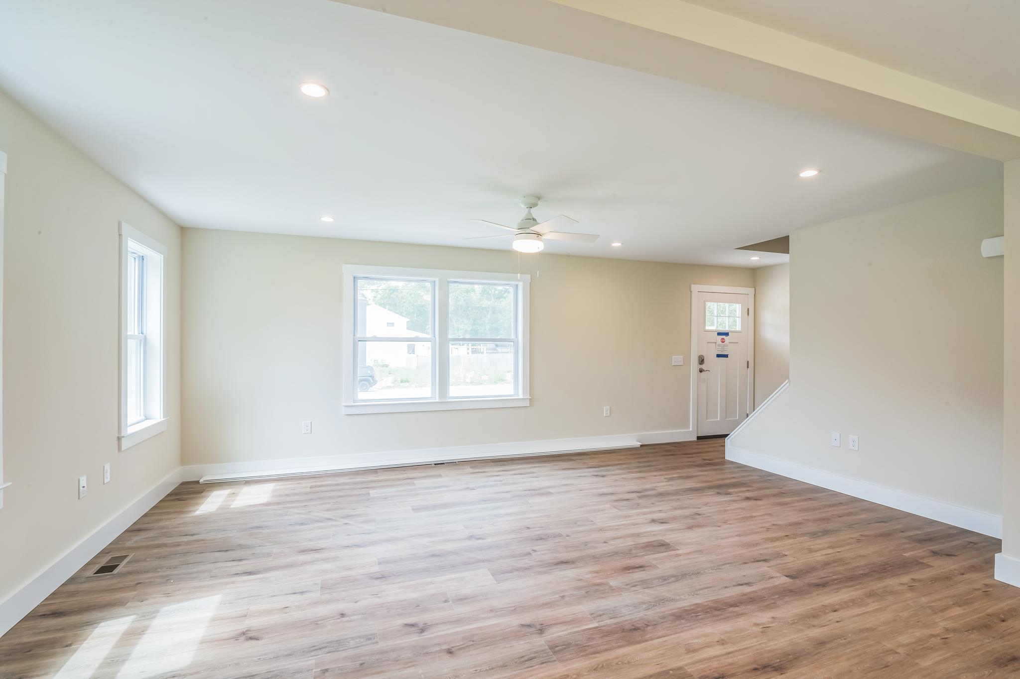 70 West Rising Sun Drive Ocean View, NJ 08230 - Photo 23 of 34 an empty room with wooden floor and windows