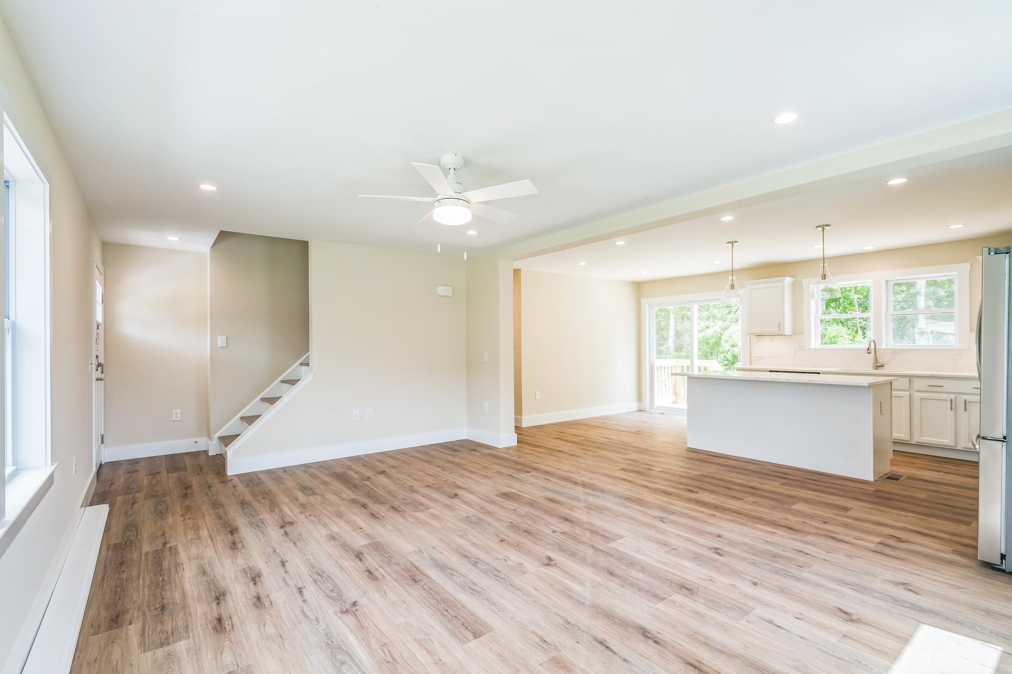 70 West Rising Sun Drive Ocean View, NJ 08230 - Photo 33 of 34 a view of an empty room with wooden floor and a kitchen
