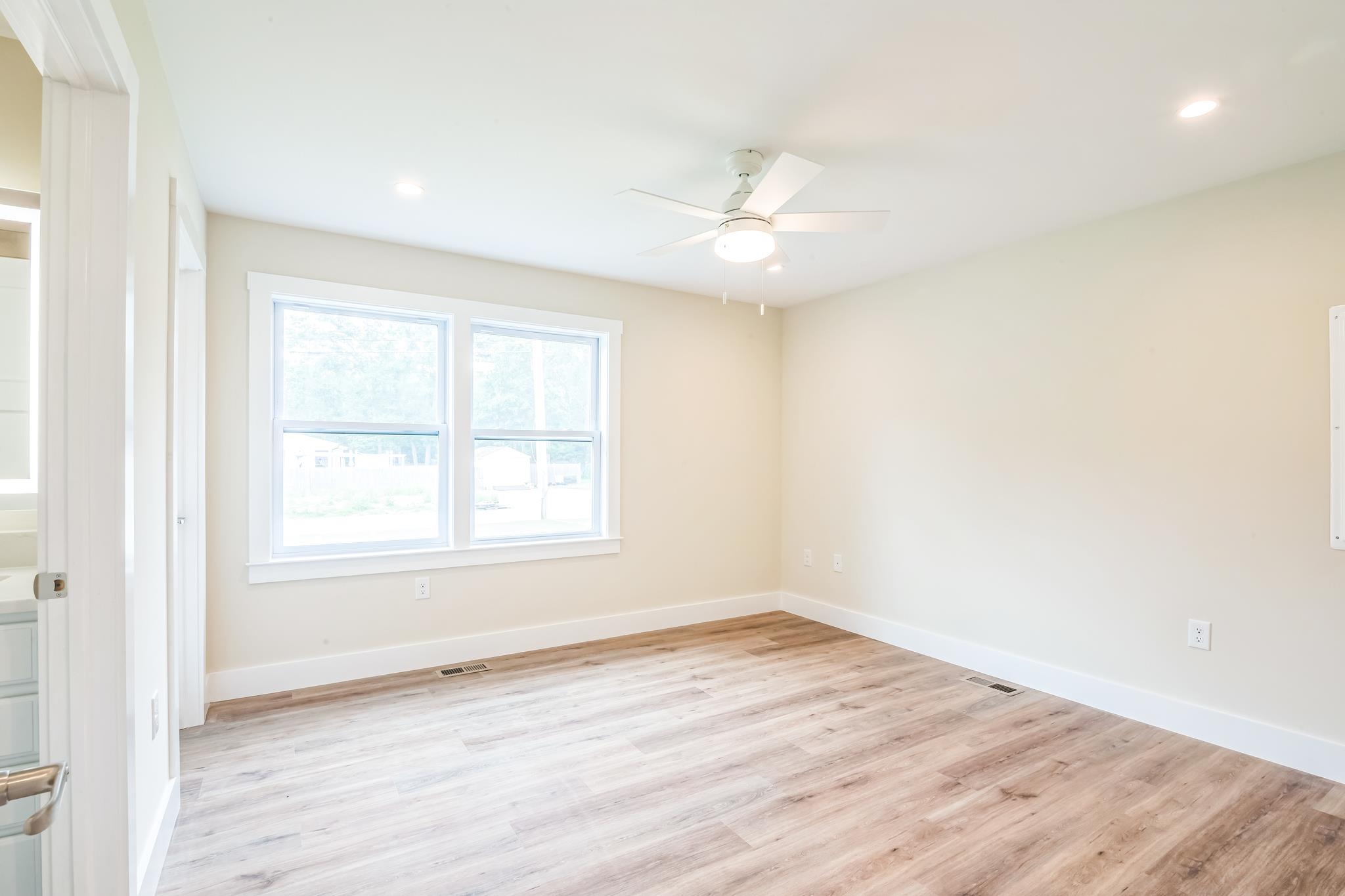 70 West Rising Sun Drive Ocean View, NJ 08230 - Photo 4 of 34 wooden floor in an empty room with a window