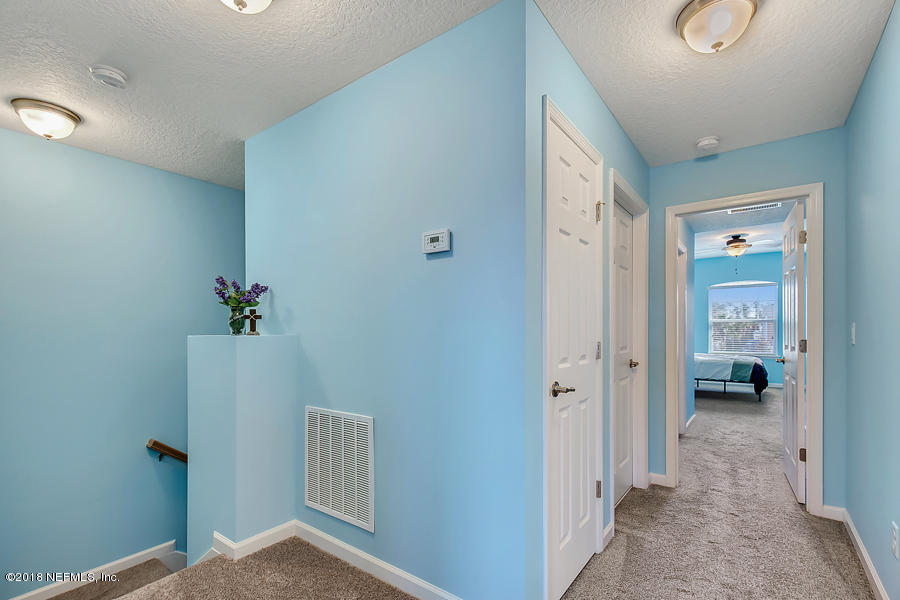 122 Nelson Lane St. Johns, FL 32259 - Photo 12 of 33 a view of a hallway with closet and a livingroom view