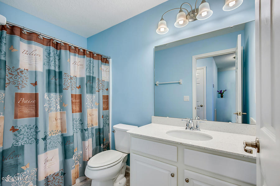 122 Nelson Lane St. Johns, FL 32259 - Photo 16 of 33 a bathroom with a sink a toilet and shower