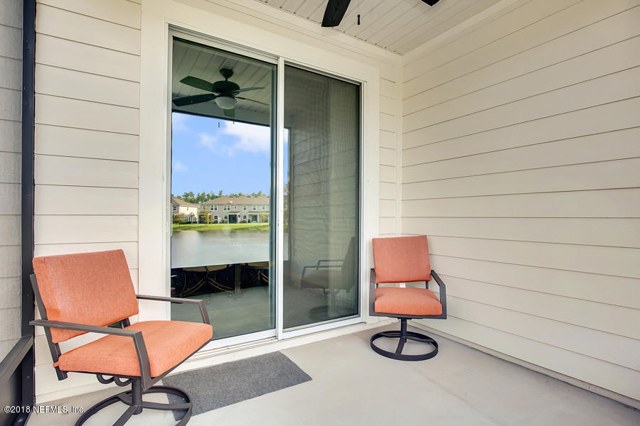 122 Nelson Lane St. Johns, FL 32259 - Photo 21 of 33 a view of table and chair in room with wooden floor