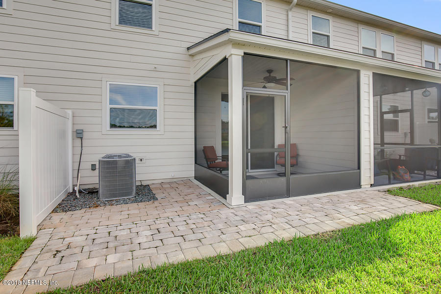 122 Nelson Lane St. Johns, FL 32259 - Photo 22 of 33 a view of a porch with a table and chair