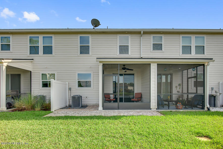 122 Nelson Lane St. Johns, FL 32259 - Photo 23 of 33 a view of a house with a yard and plants