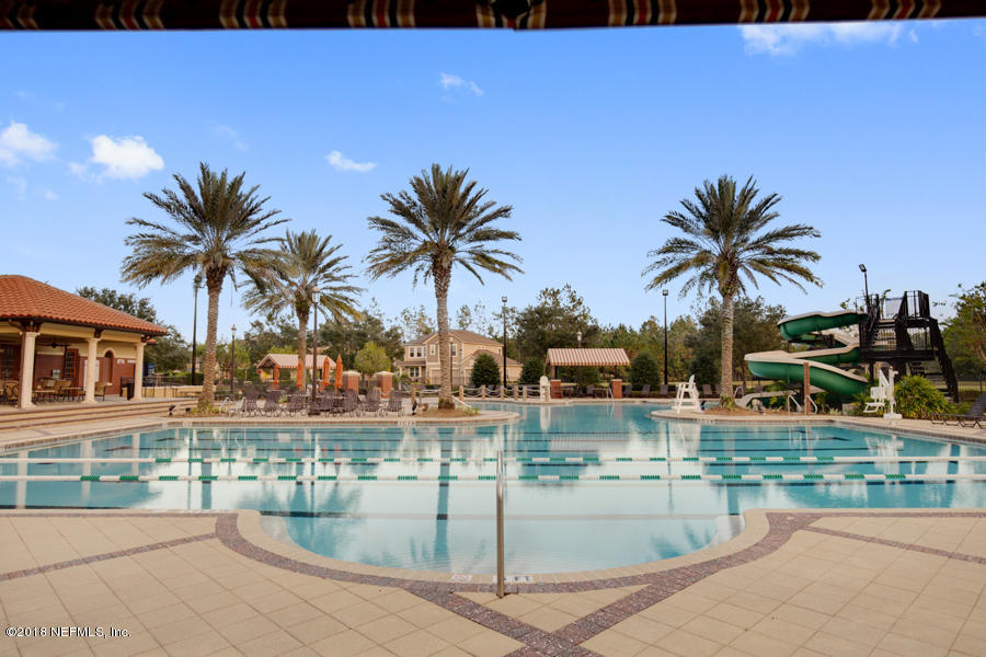 122 Nelson Lane St. Johns, FL 32259 - Photo 29 of 33 a swimming pool with outdoor seating