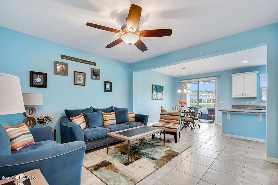 122 Nelson Lane St. Johns, FL 32259 - Photo 6 of 33 a living room with furniture and wooden floor