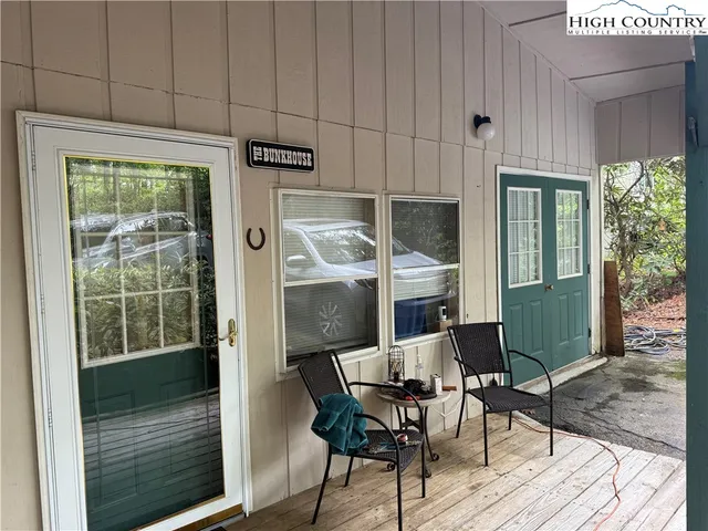 a dining room with furniture and a window