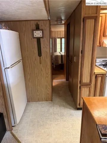 a view of a kitchen from the hallway