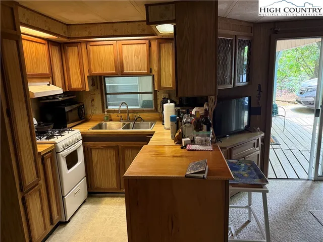 a room with furniture a window and a fireplace